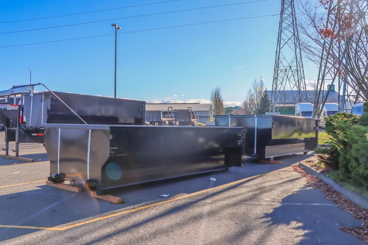 Roll-off dumpster ready for waste disposal at job site for Concrete Dumpster Rental in Montebello